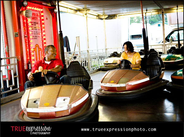 couple riding the bumper cars